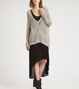 An oversized knit that doesn't lose its femininity, thanks to a creative open back and chic high-low hem.Plunging v-neckLong sleevesHigh-low hemCrossover detail on open backAbout 34 from shoulder to hem65% viscose/35% polyesterDry cleanImported of Italian fabricModel shown is 5'10 (177cm) wearing US size Small.