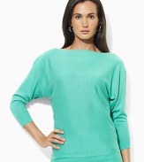 Channel modern elegance in the Jezzy sweater, rendered in a luxuriously soft blend of silk and cashmere with dramatic dolman sleeves and chic buttons at the neckline.