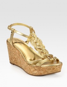 Brilliantly braided metallic leather t-strap with an adjustable strap, grounded by a natural cork wedge and platform. Cork wedge, 3 (75mm)Covered platform, 1 (25mm)Compares to a 2 heel (50mm)Metallic leather upperLeather liningRubber solePadded insoleImportedOUR FIT MODEL RECOMMENDS ordering true size. Brilliantly braided metallic leather t-strap with an adjustable strap, grounded by a natural cork wedge and platform. Cork wedge, 3 (75mm)Covered platform, 1 (25mm)Compares to a 2 heel (50mm)Metallic leather upperLeather liningRubber solePadded insoleImportedOUR FIT MODEL RECOMMENDS ordering true size.