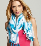 Add a touch of bright whimsy to any outfit with this oblong scarf in a turquoise and white Ikat pattern.