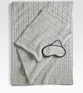 The ultimate in luxury and comfort, this soft, cable-knit set includes a travel blanket and sleep mask that tucks neatly into a matching carry case. Carry case doubles as a pillowcase for airline pillow. Pillow not included Four-ply yarn Carry case has zip closure Blanket, 36 X 60 Cashmere Dry clean Imported