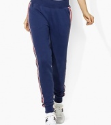 In celebration of the 2012 Olympic Games, a skinny-fitting sweatpant is designed from super-soft fleece with sleek, athletic-inspired stripes down the sides.