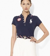 An iconic polo shirt is crafted in a slim stretch silhouette from breathable cotton mesh and accented with bold country embroidery to celebrate Team USA's participation in the 2012 Olympics.