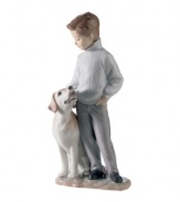 Boy's best friend. A charming gift for dog owners, this handcrafted Lladro figurine features a dapper young man and his doting Labrador.