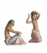 Slipping a single blossom in her hair, the Tropical Flower figurine has a sense of peace that can only come from living by the ocean. Handmade and glazed in Lladro porcelain. Shown right.