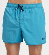 With stitched details and a grip-tape back patch pocket, these stylish swim trunks are both sporty and functional.Elastic drawstring waistStitch detail at flySlash side pocketsBack grip-tape patch pocketMesh liningPolyamidePolyester liningMachine washImported