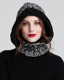 Wrap up in style as the degrees drop with this chunky knit hoodie from Echo. A braided trim lends added texture and frames the face. Wrap up in style as the degrees drop with this chunky knit hoodie from Echo. A braided trim lends added texture and frames the face.