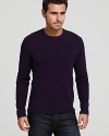 A Victorinox crewneck sweater features shoulder and elbow patches, reinforcing a refined military-inspired look.