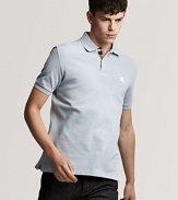 The classic fit polo from Burberry, accented tastefully with a check pattern inside the button placket and an embroidered logo at the left chest.
