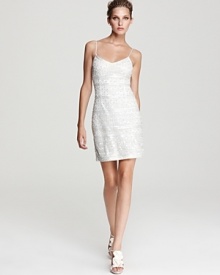 An ornate pattern of beads sparkle on this stunning Theia slip dress. An ornate pattern of beads sparkle on this stunning Theia slip dress.