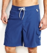 You'll be beach-ready with solid surf style with these swim shorts from Nautica.