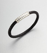 A simple design with modern sensibilities defines this woven leather bracelet, accented by a sterling silver clasp.LeatherSterling silverAbout 3 diam.Made in the United Kingdom