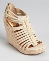 A strappy sandal from Dolce Vita, the Tatiana wedges exude summer style with a raffia heel.