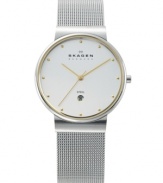 When style perfectly melds with function. This Skagen Denmark timepiece features a signature silvertone stainless steel mesh bracelet and case with a goldtone bezel, markers, and dots-- all contrasted on a white dial with a date window. Three-hand, quartz movement. Water resistant to 30 meters.