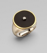 From the Nile Collection. A dramatic disc of black onyx is centered with one sparkling white topaz, framed in gleaming goldplate and set atop a brushed sterling silver band.Black onyx and white topazSterling silverGoldplatedDiameter, about ¾Imported