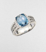 From the Petite Wheaton Collection. A stunning, faceted blue topaz stone flanked by brilliant diamonds on a sterling silver, triple-row shank. Blue topazDiamonds, .1 tcwSterling silverImported