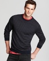 Knit entirely from soft merino wool, this clever design features thin stripes all over and solid elbow patches for unique flair.