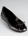 Lauren Ralph Lauren's classic Miram flats slip-on-and-go with the addition of elastic goring at the bow-wrapped toe.