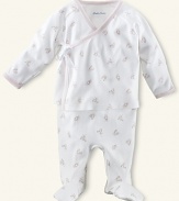 Ralph Lauren Childrenswear printed 2 piece set. An adorable kimono-style top and pant set in soft cotton jersey. Wrap top has long sleeves with fold-over detail. V-neckline with side ribbon tie. A single-snap closure at the hem. Ribbing at the neckline, placket and cuffs. Footed pant has elastic waistband and straight leg. Signature embroidered pony accents the chest.
