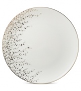 Fringed with shimmering leaves of platinum and mica, this bone china accent plate turns your table into a springtime utopia. Its sleek coupe shape is a vision of modern elegance in platinum-banded white.
