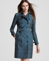 A classic Burberry trench equals an essential staple--in a dark peacock hue, this wardrobe standout is a fresh take on the iconic silhouette.