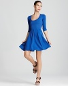 A cozy ponte knit takes on a trend-right cobalt hue. This classic Aqua dress boasts a deep scoop neck and playful circle skirt.