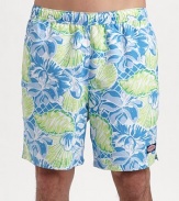 A bright mix of tropical flowers and seashells lends seagoing style to an easy-fitting swim favorite. Elastic waist with internal drawstring Side slash, back patch pockets Mesh lining Inseam, about 7 Polyester Machine wash Imported 