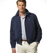 Classic fitting, zip-front windbreaker in high performance, sueded microfiber. Accented with tattersall cotton twill body lining. Buttoned throat latch, elastic waistband and buttoned cuffs. Slash pockets provide easy access and comfort. Inside pocket. Bi-swing construction for ease of movement. Polo's signature embroidered pony accents the chest.