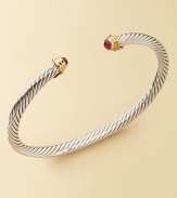 From The Cable Kids Collection. A charming sterling silver cable with ruby end caps set in 18k gold. Ruby Sterling silver and 18k yellow gold Cable, 4mm Diameter, about 2 Made in USA