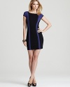 Work an alluring silhouette in this GUESS dress, featuring rich pops of color and a sheer mesh panel at the back.