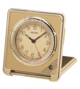 Subtle deco details grace this fine alarm clock from Seiko, perfect for traveling anywhere. Square goldtone and gray mixed metal folding case. Rotating bezel sets alarm. Round goldtone dial with logo, numeral indices, alarm with snooze and luminous hands. Folds into a carrying case. Seven-year battery included. Measures approximately 2-3/4 x 2-5/8 x 1/2. One-year limited warranty.