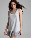 A darling tank dress with a contrast silk neckline and ruffle hem.