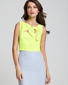 This silk Nanette Lepore top is going to bow you over! Designed with a playful tie at the front and cutout detail, the close-fitting style flaunts an touch of coquettish flair to satisfy your flirty side. This silk Nanette Lepore top is going to bow you over! Designed with a playful tie at the front and cutout detail, the close-fitting style flaunts an touch of coquettish flair to satisfy your flirty side.