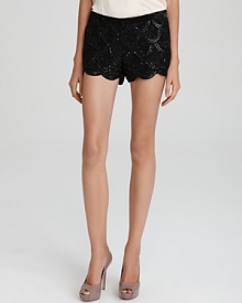 Echo vintage-inspired decadence in a modern silhouette with these Basix sequin shorts, touting a demure scalloped hem. Echo vintage-inspired decadence in a modern silhouette with these Basix sequin shorts, touting a demure scalloped hem.