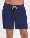 The classic Traveler swim short is rendered in sleek, quick-drying microfiber in a vibrant plaid pattern for cool, casual beach style.Elastic waistband with drawstring tie closureSide slash pocketsBack waist drainage grommetsBack flap patch pocketMesh liningInseam, about 4¾NylonMachine washImported