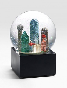 EXCLUSIVELY OURS. The Dallas musical water globe features city scenes and landmarks including: Reunion Tower, Magnolia Building First Interstate Tower, Big Tex and more Plays Deep In The Heart Of Texas Glass dome and resin figures 6 high Imported