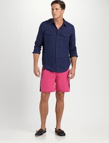 Channel iconic style in a sporty swim trunk, handsomely crafted from quick-drying microfiber with a bold stripe and screen-printed detailing.Shoestring waistBack patch pocketMesh liningInseam, about 857% cotton/43% nylonMachine washImported Channel iconic style in a sporty swim trunk, handsomely crafted from quick-drying microfiber with a bold stripe and screen-printed detailing.Shoestring waistBack patch pocketMesh liningInseam, about 857% cotton/43% nylonMachine washImported