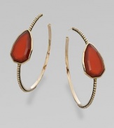 From the Trujillo Collection. A slender beaded hoop has a striking centerpiece of a faceted teardrop of rich red agate.Red agateBronzeDiameter, about 2Post backMade in USA