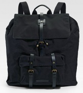 A utility design with city sophistication in rugged cotton canvas. A roomy, hold-everything backpack is finished with leather straps that hold everything together. Adjustable shoulder straps Top handle Drawstring closure Exterior front pocket Interior zip pocket Cotton 18W X 20½H X 5½D Imported 