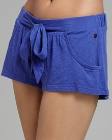 Soft pajama shorts with large tie detail and pockets at front. Soft pajama shorts with large tie detail and pockets at front.