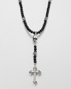 A traditional cross pendant is suspended from an impeccable strand of black onyx beads with sculpted skull detail for an edgy, modern update.Sterling silverBlack onyxLength about 26Toggle claspMade in USA