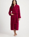 Wrap her in the incomparable luxury of this cozy, plush robe, sculpted with a subtle abstract floral motif.Shawl collarClassic wrap stylingSelf sashPatch pocketsLong sleevesAbout 48 longPolyesterMachine washImported