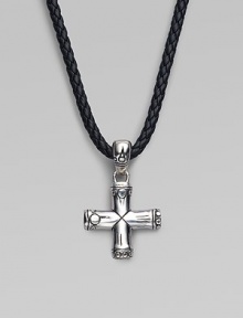 A handsomely crafted sterling silver cross pendant hangs from a finely braided leather necklace. Adjustable necklace, 18-20 Imported