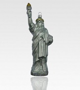 Celebrate freedom this holiday season by hanging a glittering Statue of Liberty ornament on your tree.Handmade and hand-paintedGlassAbout 8H X 3W X 1.75DImported