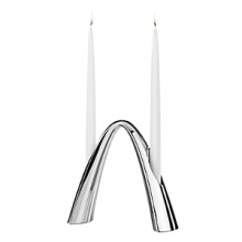 Gracefully arched stainless steel candle holder, use alone or combine with the smaller size for a 4-arm centerpiece. Gracefully arched stainless steel candle holder, use alone or combine with the smaller size for a 4-arm centerpiece.