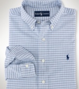 A masculine check pattern lends preppy style to a classic-fitting sport shirt, rendered in oxford-woven cotton for stylish comfort.