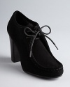 Lauren Ralph Lauren gives lace up chukka booties a luxe twist in velvety suede on stacked heels.