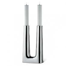 The candlestick was originally created in 1960 as an altar candle for use in a modern Scandinavian-style church.The 2007 version is in stainless steel and holds two tapered candles-the effect is striking. The structure of the candleholder is in many ways an iconic example of clean-lined Danish design of the post-World War II era. The candlestick was originally created in 1960 as an altar candle for use in a modern Scandinavian-style church.The 2007 version is in stainless steel and holds two tapered candles-the effect is striking. The structure of the candleholder is in many ways an iconic example of clean-lined Danish design of the post-World War II era.