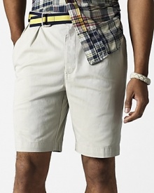 Classic fitting shorts in washed cotton tissue chino. Standard-rise belted waist. Zip fly with button closure. Double-forward pleats, generous straight leg. Side seam pockets, button back welt pocket.
