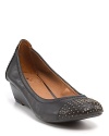 Shiny studs toughen up Lucky Brand's denim demi-wedges. Pair with a pencil skirt for pretty-punk style.